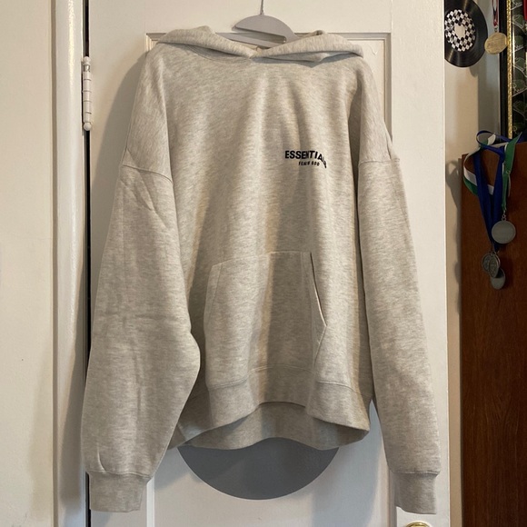 grey fear of god essentials front logo popover hoody